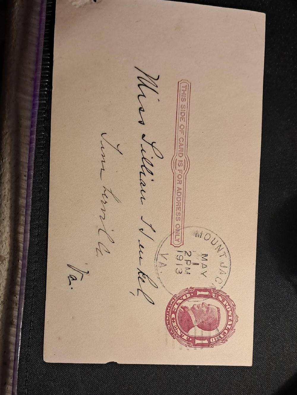 Vintage Postcard with Red Postal Stamp and Handwritten Address